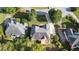 Aerial view of a tan home featuring a deck, mature trees and neighboring homes and lawns at 915 Summer Wind Pl, Roswell, GA 30075