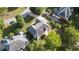 Aerial view showcasing a tan home featuring a deck, mature trees and neighboring homes at 915 Summer Wind Pl, Roswell, GA 30075