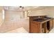 Large finished basement with bar area, carpet flooring, and neutral paint at 915 Summer Wind Pl, Roswell, GA 30075