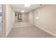 Basement flex space featuring large mirrored wall, carpeted floor, and access to a backyard view at 915 Summer Wind Pl, Roswell, GA 30075