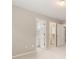 Bright bedroom with neutral walls, plush carpet, and doorways to a bathroom and closet at 915 Summer Wind Pl, Roswell, GA 30075