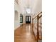 Grand foyer with gleaming hardwood floors, soaring ceilings, and staircase offering a warm welcome at 915 Summer Wind Pl, Roswell, GA 30075