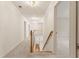 Upstairs hallway featuring neutral carpet, white walls, and wood trim, offering a bright and open feel at 915 Summer Wind Pl, Roswell, GA 30075