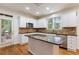 Beautiful kitchen with a center island, stainless steel appliances, and direct access to the outdoor deck at 915 Summer Wind Pl, Roswell, GA 30075