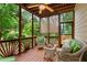 Cozy screened porch with ceiling fan and comfortable seating at 915 Summer Wind Pl, Roswell, GA 30075