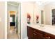 Hall bathroom featuring a single sink vanity and carpeted floors at 3110 Dickson Ne St, Brookhaven, GA 30319