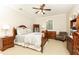 Comfortable bedroom with a wooden bed frame, soft neutral tones, and a cozy reading nook for relaxation at 3110 Dickson Ne St, Brookhaven, GA 30319