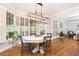 Dining area with large windows, decorative light fixture, and access to living room at 3110 Dickson Ne St, Brookhaven, GA 30319