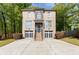 Traditional two-story brick home featuring a two-car garage and professionally landscaped front yard at 3110 Dickson Ne St, Brookhaven, GA 30319