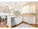 Bright kitchen with granite countertops, stainless steel appliances, and a view to the breakfast area at 3110 Dickson Ne St, Brookhaven, GA 30319