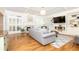Comfortable living room with fireplace, hardwood flooring, plantation shutters and built-in shelving at 3110 Dickson Ne St, Brookhaven, GA 30319