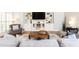 Living room featuring custom built-ins, hardwood floors, and a modern area rug at 3110 Dickson Ne St, Brookhaven, GA 30319