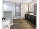 Modern bathroom with double vanity, walk-in shower, and soaking tub at 5211 Benjamin Trl, Ellenwood, GA 30294