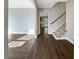 Inviting entryway with hardwood floors and a staircase at 5211 Benjamin Trl, Ellenwood, GA 30294