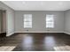 Bright room with hardwood floors, windows, and lots of light at 5211 Benjamin Trl, Ellenwood, GA 30294