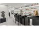 Stylish basement bar with modern shelving and bar stool seating at 8610 Sentinae Chase Dr, Roswell, GA 30076