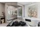 Elegant bathroom featuring soaking tub, glass shower, heated towel rack, and serene outdoor view at 8610 Sentinae Chase Dr, Roswell, GA 30076