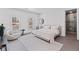 Bright bedroom featuring large windows, modern decor, and an ensuite bathroom entrance at 8610 Sentinae Chase Dr, Roswell, GA 30076