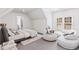 Spacious bedroom with ample natural light, modern furnishings, and a comfortable seating area at 8610 Sentinae Chase Dr, Roswell, GA 30076
