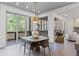Cozy dining area features sliding glass doors opening to a deck with a beautiful view of nature at 8610 Sentinae Chase Dr, Roswell, GA 30076