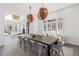 Bright dining area with a large dining table and open layout, ideal for gatherings and entertaining guests at 8610 Sentinae Chase Dr, Roswell, GA 30076
