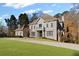 Attractive two-story home featuring a spacious front lawn and stylish architectural details at 8610 Sentinae Chase Dr, Roswell, GA 30076