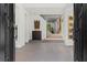 Elegant foyer with an open staircase, modern art, and neutral tones creates a sophisticated entry at 8610 Sentinae Chase Dr, Roswell, GA 30076