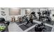 Well-equipped home gym featuring various exercise machines and mirrored walls at 8610 Sentinae Chase Dr, Roswell, GA 30076