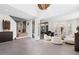 Bright, open-concept living room featuring modern decor and soaring ceilings, creating an inviting and spacious atmosphere at 8610 Sentinae Chase Dr, Roswell, GA 30076