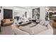 Open-concept living room features multiple seating areas, art, and seamless flow for stylish entertaining at 8610 Sentinae Chase Dr, Roswell, GA 30076