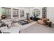 Modern living room boasts large windows, stylish seating, and eye-catching art for a sophisticated space at 8610 Sentinae Chase Dr, Roswell, GA 30076