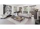 Spacious living room featuring large windows, modern decor, and comfortable seating creates a relaxing atmosphere at 8610 Sentinae Chase Dr, Roswell, GA 30076