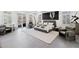 Large main bedroom with windows, a balcony, lounge chairs, and a unique decor at 8610 Sentinae Chase Dr, Roswell, GA 30076