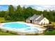Aerial view of the community clubhouse featuring a large pool and kiddie pool at 13562 Whitman Ln, Covington, GA 30014