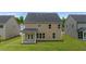 The backyard features a covered patio and a well-maintained lawn, perfect for outdoor activities at 13562 Whitman Ln, Covington, GA 30014