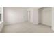 Bright bedroom with neutral carpet, closet, and natural light from the window at 13562 Whitman Ln, Covington, GA 30014