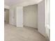 Bright bedroom with neutral carpet and an open closet featuring folding doors at 13562 Whitman Ln, Covington, GA 30014