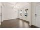 Bright dining room features a modern chandelier and hardwood floors at 13562 Whitman Ln, Covington, GA 30014