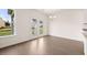 Open dining area with hardwood floors, glass doors to backyard and a modern chandelier at 13562 Whitman Ln, Covington, GA 30014