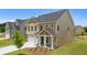 Two-story home with a two car garage and covered front porch at 13562 Whitman Ln, Covington, GA 30014
