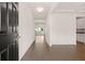 Inviting home foyer with hardwood flooring and easy access to the kitchen at 13562 Whitman Ln, Covington, GA 30014