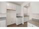Kitchen area showcases white cabinets and granite countertops at 13562 Whitman Ln, Covington, GA 30014
