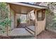 View of a charming brick home's back porch with wooden deck and convenient access at 24 Ball Creek Hl, Atlanta, GA 30350