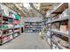 Unfinished basement featuring storage shelving and exposed ceiling at 24 Ball Creek Hl, Atlanta, GA 30350