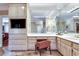 Bathroom has a built-in vanity, ample storage, a marble countertop, and a large set of mirrors at 24 Ball Creek Hl, Atlanta, GA 30350