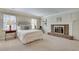 Spacious bedroom with brick fireplace, large windows, and neutral color palette at 24 Ball Creek Hl, Atlanta, GA 30350
