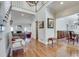 Open foyer view to a living room with a fireplace and adjacent dining room at 24 Ball Creek Hl, Atlanta, GA 30350
