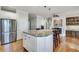Large kitchen island features granite countertops and bar stool seating at 24 Ball Creek Hl, Atlanta, GA 30350