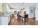 Spacious kitchen with large island, granite counters, and stainless steel appliances at 24 Ball Creek Hl, Atlanta, GA 30350