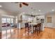 Open floor plan showing kitchen, island with seating, and living room in the background at 24 Ball Creek Hl, Atlanta, GA 30350